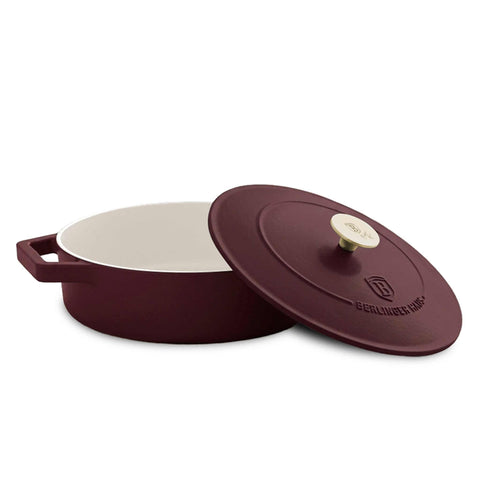 Product image of Shallow pot 26cm cast iron. Part of the Leonardo Collection . Features: • Material: cast iron with 3 layers shiny ENAMEL coating • Size: Ø26*7,5 cm 2,57 L • Color: matt bordeaux- white. (Studio view). Official Berlinger Haus product, boosted by Promintra sl.