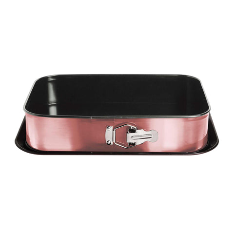 Imatge del producte del motlle desmuntable rectangular de 39x27cm. Forma part de la col·lecció I-Rose. Característiques: • Material: acer al carboni amb recobriment antiadherent de titani • Mida: 35*23*6,5 cm • Mida de la base: 39*27 cm • Color: rosa metàl·lic. (Vista d'estudi). Producte oficial de Berlinger, impulsat per Promintra sl.