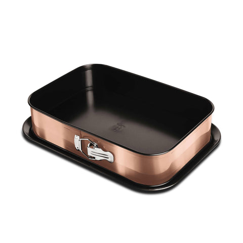 Product image of Rectangle springform 39x27cm. Part of the Metallic Line Rose Gold Edition . Features: • Material: carbon steel with titan non-stick coating • Size: 35*23*6,5 cm • Base size: 39*27 cm • Color: metallic rose gold. (Studio view). Official Berlinger Haus product, boosted by Promintra sl.