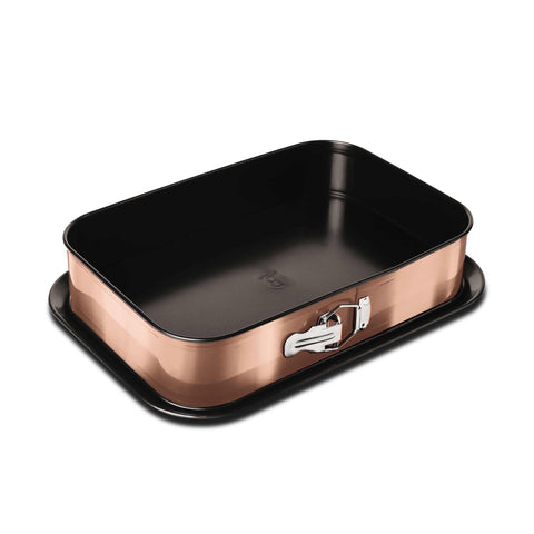 Product image of Rectangle springform 39x27cm. Part of the Metallic Line Rose Gold Edition . Features: • Material: carbon steel with titan non-stick coating • Size: 35*23*6,5 cm • Base size: 39*27 cm • Color: metallic rose gold. (Studio view). Official Berlinger Haus product, boosted by Promintra sl.
