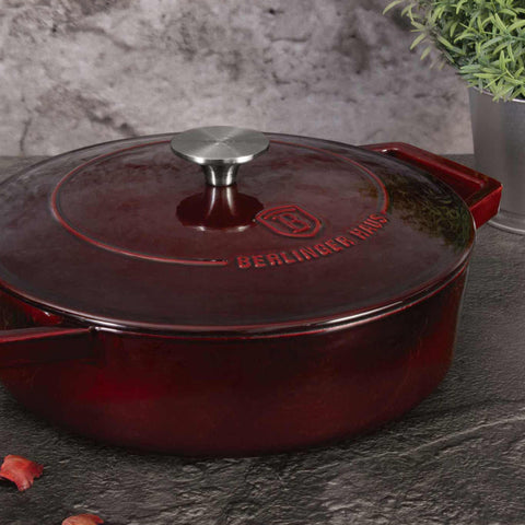 Product image of Shallow pot 26cm cast iron. Part of the Strong Mold Seria . Features: • Material: cast iron with 2 layers shiny ENAMEL coating • Size: Ø26*7,5 cm 2,57 L • Color: burgundy. (Studio view). Official Berlinger Haus product, boosted by Promintra sl.