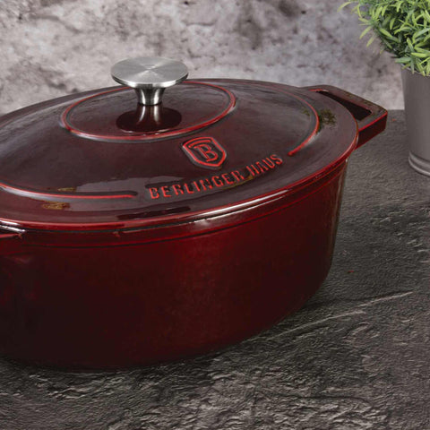Product image of Oval roaster 30cm cast iron. Part of the Strong Mold Seria . Features: • Material: cast iron with 2 layers shiny ENAMEL coating • Size: Ø30*12 cm 4,65 L • Color: burgundy. (Studio view). Official Berlinger Haus product, boosted by Promintra sl.