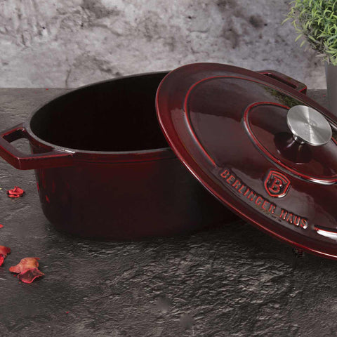 Product image of Oval roaster 30cm cast iron. Part of the Strong Mold Seria . Features: • Material: cast iron with 2 layers shiny ENAMEL coating • Size: Ø30*12 cm 4,65 L • Color: burgundy. (Studio view). Official Berlinger Haus product, boosted by Promintra sl.