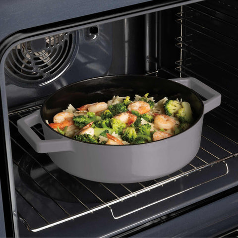 Product image of Shallow pot 26cm cast iron. Part of the Taupe Collection . Features: • Material: cast iron with 3 layers shiny ENAMEL coating • Size: Ø26*7,5 cm 2,57 L • Color: taupe. (Studio view). Official Berlinger Haus product, boosted by Promintra sl.