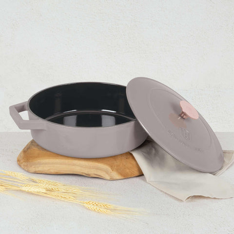 Product image of Shallow pot 26cm cast iron. Part of the Taupe Collection . Features: • Material: cast iron with 3 layers shiny ENAMEL coating • Size: Ø26*7,5 cm 2,57 L • Color: taupe. (Studio view). Official Berlinger Haus product, boosted by Promintra sl.