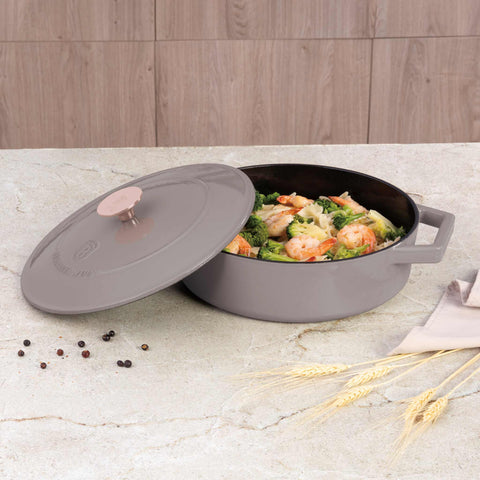 Product image of Shallow pot 26cm cast iron. Part of the Taupe Collection . Features: • Material: cast iron with 3 layers shiny ENAMEL coating • Size: Ø26*7,5 cm 2,57 L • Color: taupe. (Studio view). Official Berlinger Haus product, boosted by Promintra sl.