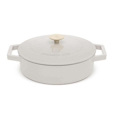 Product image of Shallow pot 26cm cast iron. Part of the Sahara Collection . Features: • Material: cast iron with 3 layers shiny ENAMEL coating • Size: Ø26*7,5 cm 2,57 L • Color: cream- white. (Studio view). Official Berlinger Haus product, boosted by Promintra sl.