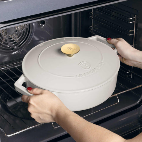 Product image of Shallow pot 26cm cast iron. Part of the Sahara Collection . Features: • Material: cast iron with 3 layers shiny ENAMEL coating • Size: Ø26*7,5 cm 2,57 L • Color: cream- white. (Studio view). Official Berlinger Haus product, boosted by Promintra sl.