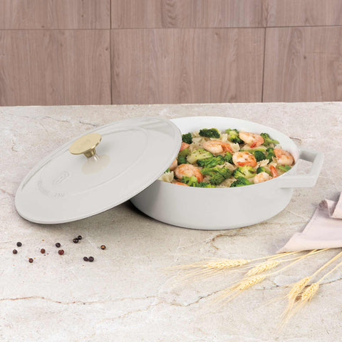 Product image of Shallow pot 26cm cast iron. Part of the Sahara Collection . Features: • Material: cast iron with 3 layers shiny ENAMEL coating • Size: Ø26*7,5 cm 2,57 L • Color: cream- white. (Studio view). Official Berlinger Haus product, boosted by Promintra sl.