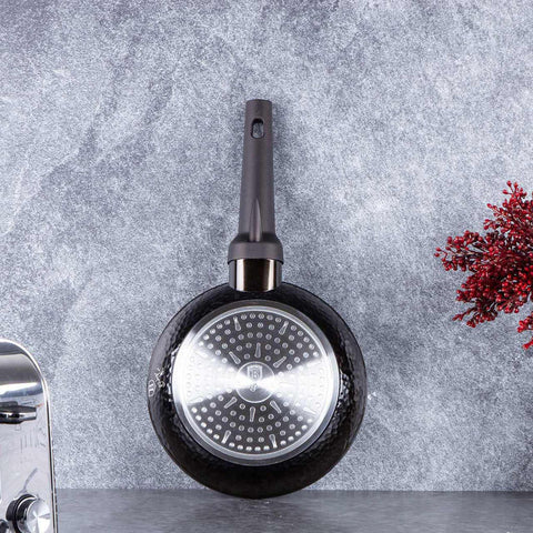 Product image of Frypan 20cm. Part of the Primal Gloss Collection . Features: • Material: forged aluminum • Frypan Ø20*4,5 cm 1,0L • Color: dark grey with black shadow and shining hammer effect REGISTERED DESIGN BY BERLINGER .... (Studio view). Official Berlinger Haus product, boosted by Promintra sl.
