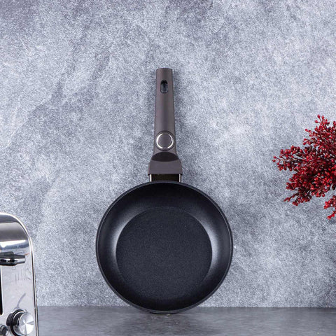 Product image of Frypan 20cm. Part of the Primal Gloss Collection . Features: • Material: forged aluminum • Frypan Ø20*4,5 cm 1,0L • Color: dark grey with black shadow and shining hammer effect REGISTERED DESIGN BY BERLINGER .... (Studio view). Official Berlinger Haus product, boosted by Promintra sl.