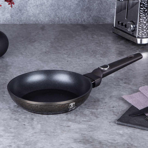 Product image of Frypan 20cm. Part of the Primal Gloss Collection . Features: • Material: forged aluminum • Frypan Ø20*4,5 cm 1,0L • Color: dark grey with black shadow and shining hammer effect REGISTERED DESIGN BY BERLINGER .... (Studio view). Official Berlinger Haus product, boosted by Promintra sl.