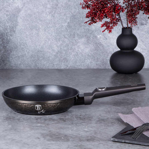 Product image of Frypan 20cm. Part of the Primal Gloss Collection . Features: • Material: forged aluminum • Frypan Ø20*4,5 cm 1,0L • Color: dark grey with black shadow and shining hammer effect REGISTERED DESIGN BY BERLINGER .... (Studio view). Official Berlinger Haus product, boosted by Promintra sl.