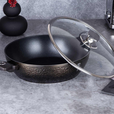 Product image of Shallow pot with lid 28cm. Part of the Primal Gloss Collection . Features: • Material: forged aluminum • Shallow pot with lid Ø28*7,5 cm 3,8L • Color: dark grey with black shadow and shining hammer effect REGISTERED DESIGN.... (Studio view). Official Berlinger Haus product, boosted by Promintra sl.