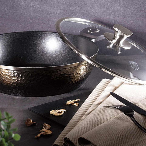 Product image of Shallow pot with lid 28cm. Part of the Primal Gloss Collection . Features: • Material: forged aluminum • Shallow pot with lid Ø28*7,5 cm 3,8L • Color: dark grey with black shadow and shining hammer effect REGISTERED DESIGN.... (Studio view). Official Berlinger Haus product, boosted by Promintra sl.