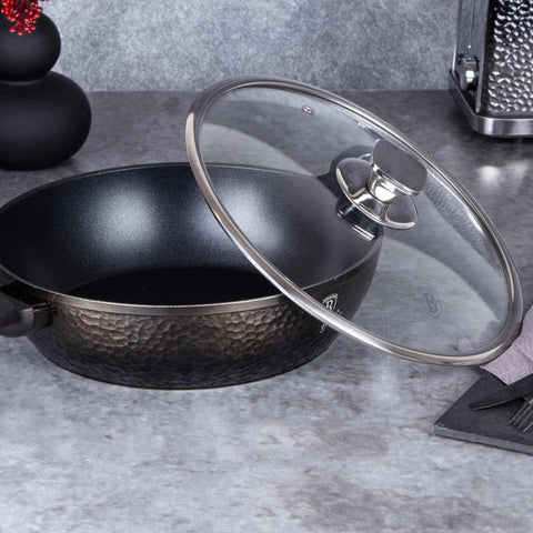 Product image of Shallow pot with lid 28cm. Part of the Primal Gloss Collection . Features: • Material: forged aluminum • Shallow pot with lid Ø28*7,5 cm 3,8L • Color: dark grey with black shadow and shining hammer effect REGISTERED DESIGN.... (Studio view). Official Berlinger Haus product, boosted by Promintra sl.