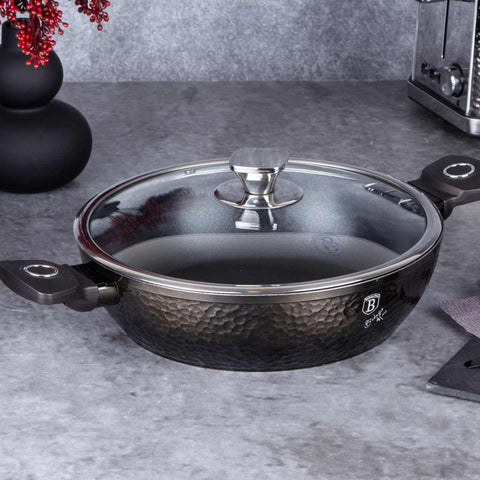 Product image of Shallow pot with lid 28cm. Part of the Primal Gloss Collection . Features: • Material: forged aluminum • Shallow pot with lid Ø28*7,5 cm 3,8L • Color: dark grey with black shadow and shining hammer effect REGISTERED DESIGN.... (Studio view). Official Berlinger Haus product, boosted by Promintra sl.