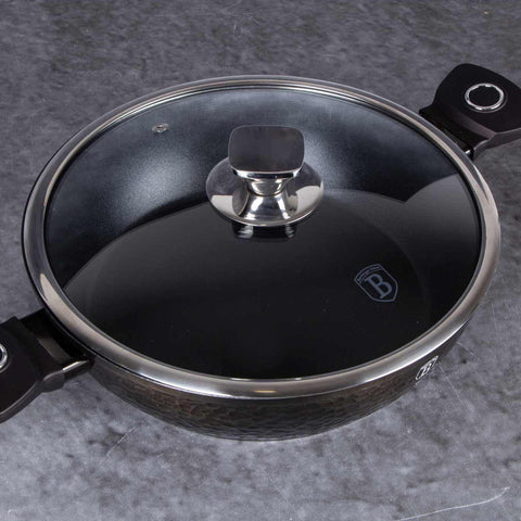 Product image of Shallow pot with lid 28cm. Part of the Primal Gloss Collection . Features: • Material: forged aluminum • Shallow pot with lid Ø28*7,5 cm 3,8L • Color: dark grey with black shadow and shining hammer effect REGISTERED DESIGN.... (Studio view). Official Berlinger Haus product, boosted by Promintra sl.