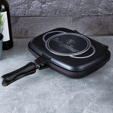 Product image of Double frypan 32cm. Part of the Granit Diamond Line . Features: • Material: cast aluminium • Size: 32*24*7 cm • Color: matt black and orange. (Studio view). Official Berlinger Haus product, boosted by Promintra sl.