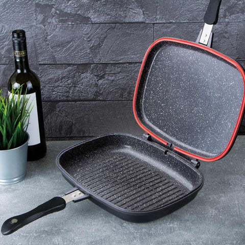Imatge del producte de la paella doble de 32 cm. Forma part de la línia Granit Diamond. Característiques: • Material: alumini fos amb recobriment de marbre • Mida: 32*24*7 cm • DOBLE INDUCCIÓ • Color: negre mat i taronja. (Vista d'estudi). Producte oficial de Berlinger, impulsat per Promintra sl.