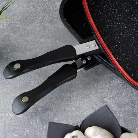 Imatge del producte de la paella doble de 32 cm. Forma part de la línia Granit Diamond. Característiques: • Material: alumini fos amb recobriment de marbre • Mida: 32*24*7 cm • DOBLE INDUCCIÓ • Color: negre mat i taronja. (Vista d'estudi). Producte oficial de Berlinger, impulsat per Promintra sl.