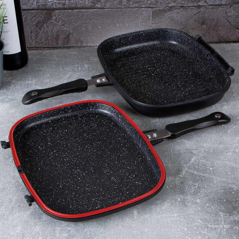 Imatge del producte de la paella doble de 32 cm. Forma part de la línia Granit Diamond. Característiques: • Material: alumini fos amb recobriment de marbre • Mida: 32*24*7 cm • DOBLE INDUCCIÓ • Color: negre mat i taronja. (Vista d'estudi). Producte oficial de Berlinger, impulsat per Promintra sl.