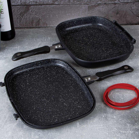 Imatge del producte de la paella doble de 32 cm. Forma part de la línia Granit Diamond. Característiques: • Material: alumini fos amb recobriment de marbre • Mida: 32*24*7 cm • DOBLE INDUCCIÓ • Color: negre mat i taronja. (Vista d'estudi). Producte oficial de Berlinger, impulsat per Promintra sl.