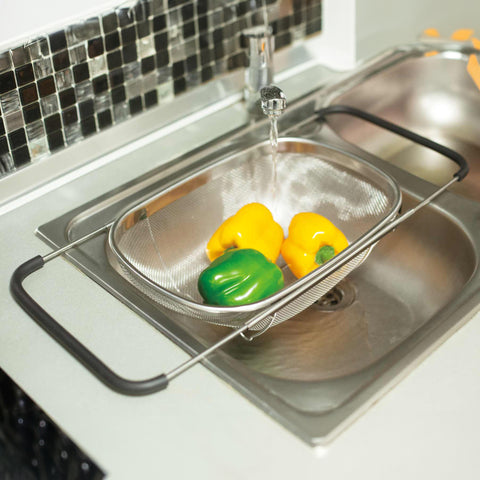 Product image of Flexible mesh basket with adjustable handles. Part of the kitchen accessories . Features: • Material: 18/10 stainless steel • Size: 34*24*11 cm. (Studio view). Official Berlinger Haus product, boosted by Promintra sl.