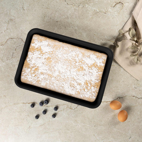 Product image of Oblong roaster 40x28cm. Part of the Leonardo Collection . Features: • Material: carbon steel with non-stick titanPro coating • Size: 40*28*7 cm • Color: matt bordeaux. (Studio view). Official Berlinger Haus product, boosted by Promintra sl.
