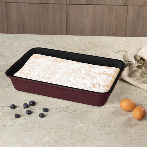 Product image of Oblong roaster 40x28cm. Part of the Leonardo Collection . Features: • Material: carbon steel with non-stick titanPro coating • Size: 40*28*7 cm • Color: matt bordeaux. (Studio view). Official Berlinger Haus product, boosted by Promintra sl.