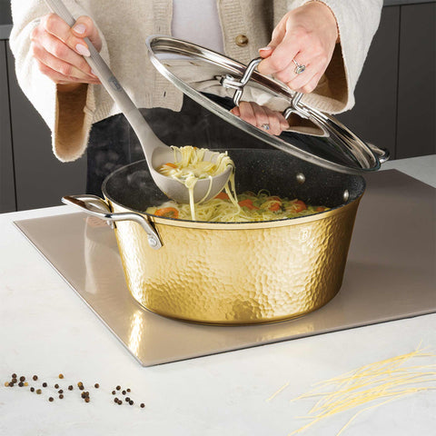 Product image of Casserole with lid 28cm. Part of the Hammered Gold Collection . Features: • Material: forged aluminum with non-stick marble coating • Casserole with lid Ø28*12,4 cm, 6,1L • Color: light gold REGISTERED DESIGN BY BERLINGER.... (Studio view). Official Berlinger Haus product, boosted by Promintra sl.
