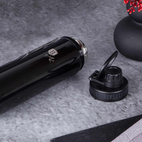 Product image of Sport bottle 720ml. Part of the Metallic Line Shiny Black Edition . Features: • Material: inner body 18/10 stainless steel • Capacity: 720 ml • Color: metallic black • Packing: half giftbox. (Studio view). Official Berlinger Haus product, boosted by Promintra sl.