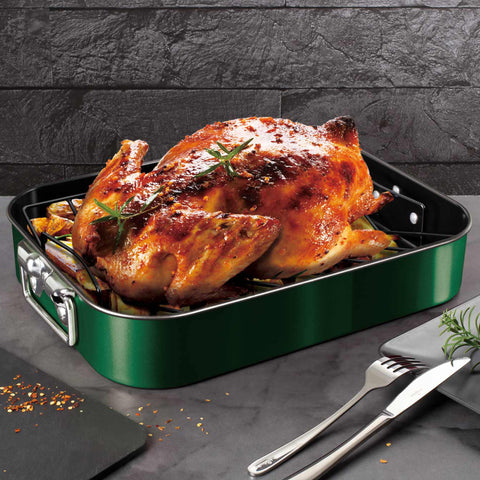 Product image of Roaster with rack. Part of the Emerald Collection . Features: • Material: carbon steel with titan non-stick coating • Size: 41,5*32*7,7 cm • Color: metallic emerald. (Lifestyle view). Official Berlinger Haus product, boosted by Promintra sl.