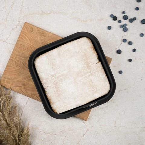 Product image of Square springform 28x28cm. Part of the Matte Black Collection/Black Rose Collection . Features: • Material: carbon steel with non-stick titanPro coating • Size: 23,8*23,8*8 cm • Base size: 28*28 cm • Color: matt black. (Studio view). Official Berlinger Haus product, boosted by Promintra sl.