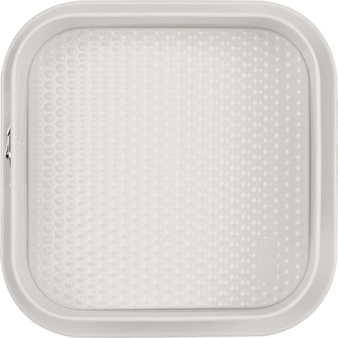 Product image of Square springform 28x28cm. Part of the Sahara Collection . Features: • Material: carbon steel with non-stick titanPro coating • Size: 23,8*23,8*8 cm • Base size: 28*28 cm • Color: matt cream. (Studio view). Official Berlinger Haus product, boosted by Promintra sl.