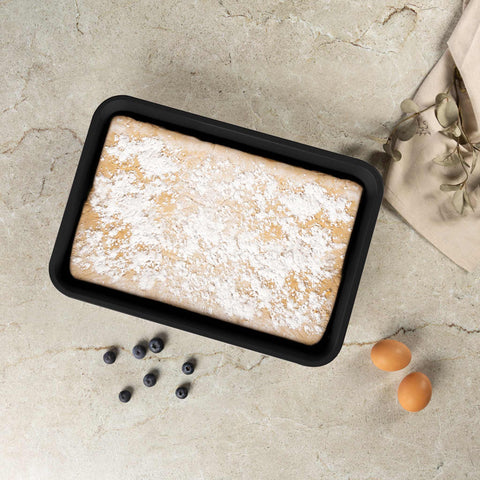 Product image of Oblong roaster 40x28cm. Part of the Matte Green Collection . Features: • Material: carbon steel with non-stick titanPro coating • Size: 40*28*7 cm • Color: matt green. (Studio view). Official Berlinger Haus product, boosted by Promintra sl.