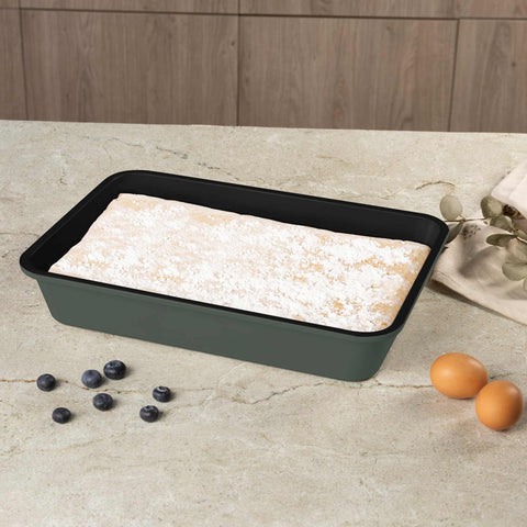Product image of Oblong roaster 40x28cm. Part of the Matte Green Collection . Features: • Material: carbon steel with non-stick titanPro coating • Size: 40*28*7 cm • Color: matt green. (Studio view). Official Berlinger Haus product, boosted by Promintra sl.