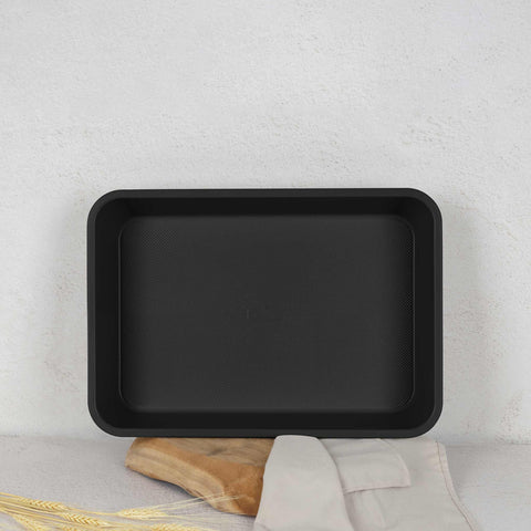 Product image of Oblong roaster 40x28cm. Part of the Matte Green Collection . Features: • Material: carbon steel with non-stick titanPro coating • Size: 40*28*7 cm • Color: matt green. (Studio view). Official Berlinger Haus product, boosted by Promintra sl.