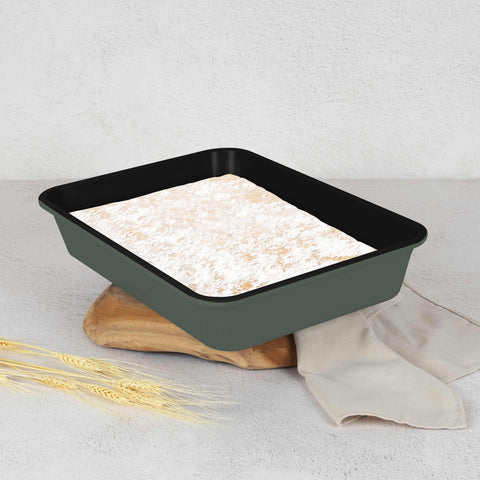 Product image of Oblong roaster 40x28cm. Part of the Matte Green Collection . Features: • Material: carbon steel with non-stick titanPro coating • Size: 40*28*7 cm • Color: matt green. (Studio view). Official Berlinger Haus product, boosted by Promintra sl.