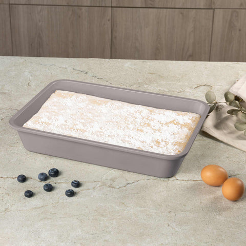 Product image of Oblong roaster 40x28cm. Part of the Taupe Collection . Features: • Material: carbon steel with non-stick titanPro coating • Size: 40*28*7 cm • Color: matt taupe. (Studio view). Official Berlinger Haus product, boosted by Promintra sl.
