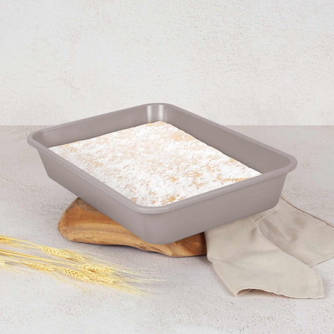 Product image of Oblong roaster 40x28cm. Part of the Taupe Collection . Features: • Material: carbon steel with non-stick titanPro coating • Size: 40*28*7 cm • Color: matt taupe. (Studio view). Official Berlinger Haus product, boosted by Promintra sl.