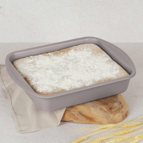 Product image of Oblong roaster 40x28,5cm. Part of the Taupe Collection . Features: • Material: carbon steel with titanPro non-stick coating • Size: 40*28,5*7 cm • Color: matt taupe. (Studio view). Official Berlinger Haus product, boosted by Promintra sl.