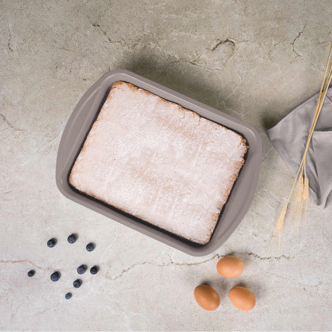 Product image of Oblong roaster 40x28,5cm. Part of the Taupe Collection . Features: • Material: carbon steel with titanPro non-stick coating • Size: 40*28,5*7 cm • Color: matt taupe. (Studio view). Official Berlinger Haus product, boosted by Promintra sl.