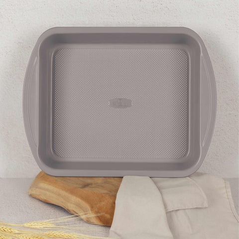 Product image of Oblong roaster 40x28,5cm. Part of the Taupe Collection . Features: • Material: carbon steel with titanPro non-stick coating • Size: 40*28,5*7 cm • Color: matt taupe. (Studio view). Official Berlinger Haus product, boosted by Promintra sl.