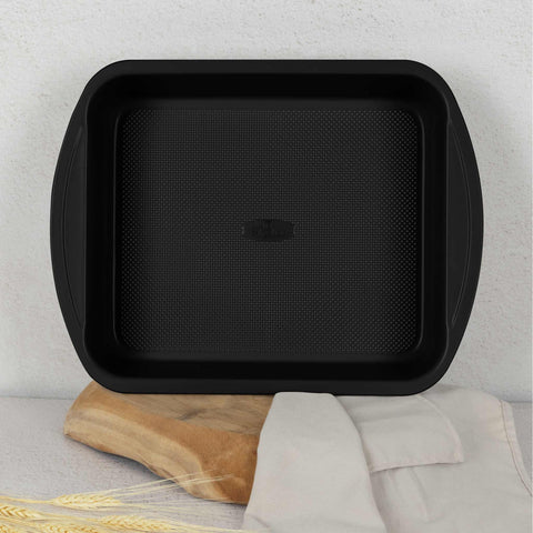 Product image of Oblong roaster 35x27cm. Part of the Leonardo Collection . Features: • Material: carbon steel with titanPro non-stick coating • Size: 35*27*6,5 cm • Color: matt bordeaux. (Studio view). Official Berlinger Haus product, boosted by Promintra sl.