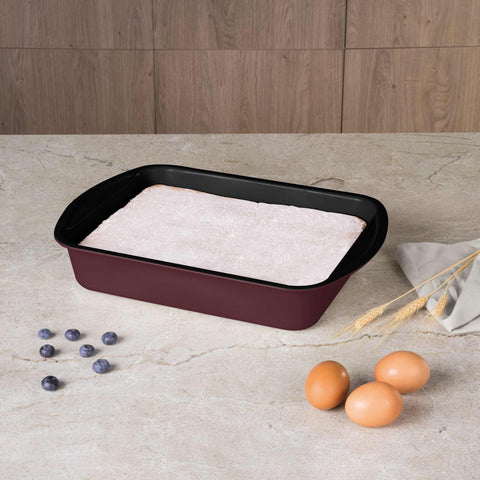 Product image of Oblong roaster 35x27cm. Part of the Leonardo Collection . Features: • Material: carbon steel with titanPro non-stick coating • Size: 35*27*6,5 cm • Color: matt bordeaux. (Studio view). Official Berlinger Haus product, boosted by Promintra sl.