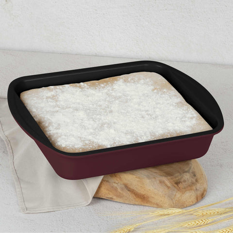 Product image of Oblong roaster 35x27cm. Part of the Leonardo Collection . Features: • Material: carbon steel with titanPro non-stick coating • Size: 35*27*6,5 cm • Color: matt bordeaux. (Studio view). Official Berlinger Haus product, boosted by Promintra sl.