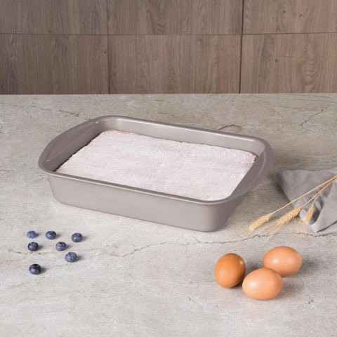 Product image of Oblong roaster 35x27cm. Part of the Taupe Collection . Features: • Material: carbon steel with titanPro non-stick coating • Size: 35*27*6,5 cm • Color: matt taupe. (Studio view). Official Berlinger Haus product, boosted by Promintra sl.