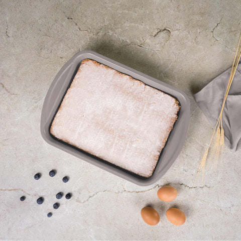 Product image of Oblong roaster 35x27cm. Part of the Taupe Collection . Features: • Material: carbon steel with titanPro non-stick coating • Size: 35*27*6,5 cm • Color: matt taupe. (Studio view). Official Berlinger Haus product, boosted by Promintra sl.