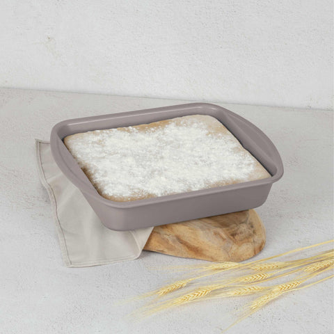 Product image of Oblong roaster 35x27cm. Part of the Taupe Collection . Features: • Material: carbon steel with titanPro non-stick coating • Size: 35*27*6,5 cm • Color: matt taupe. (Studio view). Official Berlinger Haus product, boosted by Promintra sl.